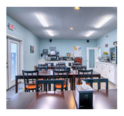 Spacious breakfast room at Alister Square Inn featuring modern seating and a welcoming ambiance