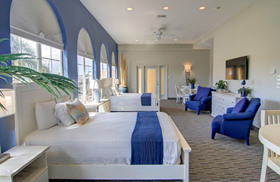 Alister Square Inn 2 Queen Bed Suite with bright interiors, arched windows, and modern decor