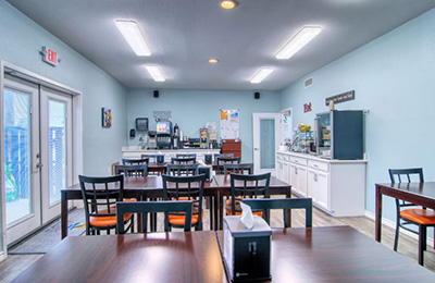 Alister Square Inn breakfast area featuring clean tables and a convenient serving counter