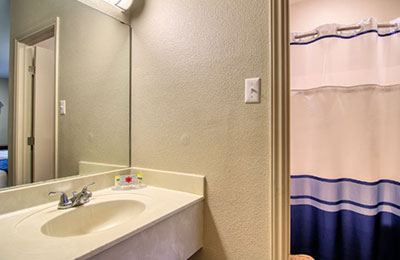 Bathroom at Alister Square Inn with sink and shower area