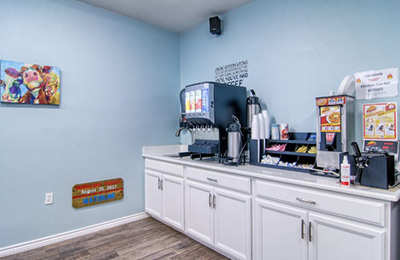 Casual breakfast area of Alister Square Inn with bright interiors and accessible dining setup