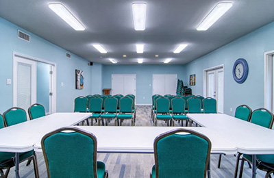 Conference room at Alister Square Inn with comfortable seating and a professional setup