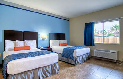 Alister Square Inn 2 Queen Bed Standard Room with stylish decor and a bright, airy ambiance