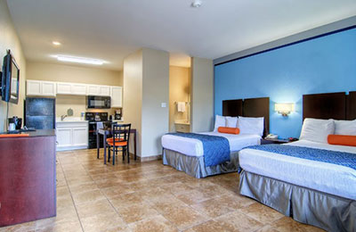 2 Full Bed Kitchen Room at Alister Square Inn with dining area, kitchen, and modern amenities