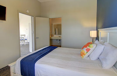 Deluxe Suite at Alister Square Inn with 2 Queen Beds, colorful decor